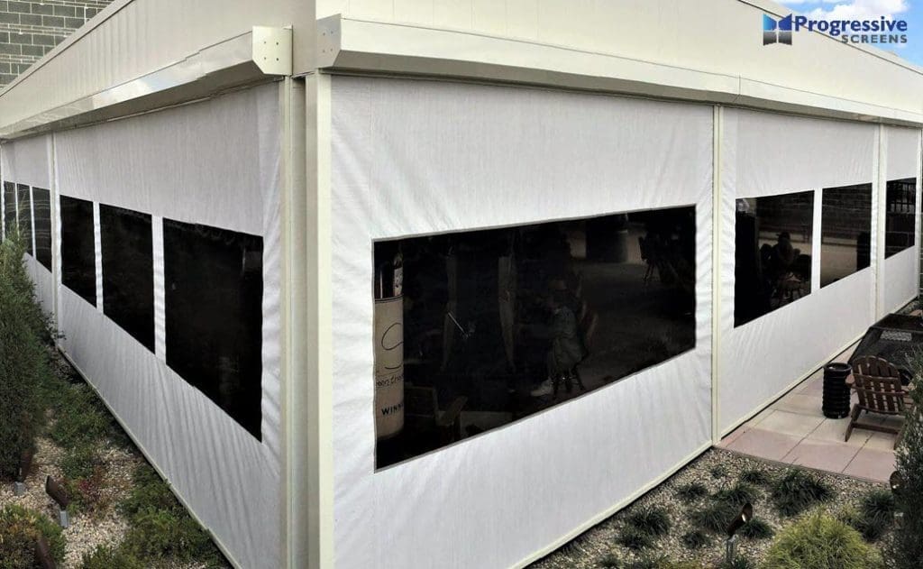 Commercial wind screen covered building by StruXure of the Rockies